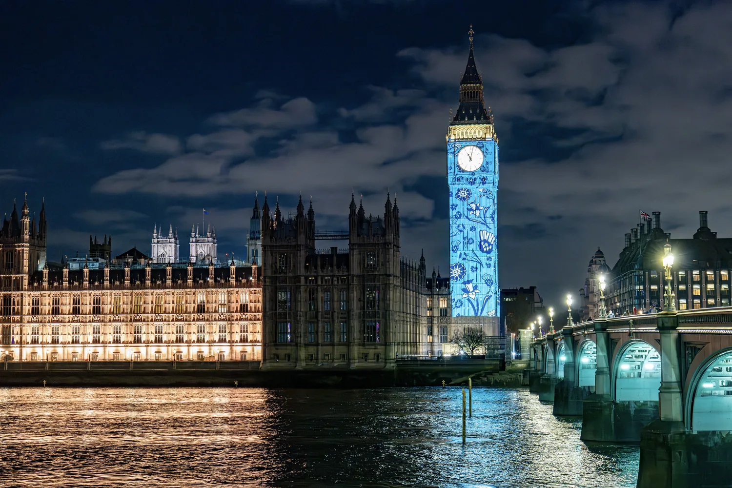 The Palace of Westminster and Big Ben under projection at night for the King’s Coronation